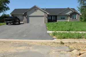 New-construction lawn installation with the company truck visible