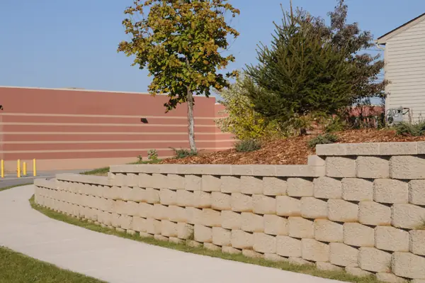 Commercial retaining wall running along a walkway